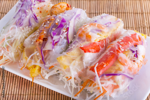 Fototapeta Naklejka Na Ścianę i Meble -  Vietnamese Spring Rolls, large variety of filled, rolled appetizers or dim sum found in East Asian and Southeast Asian cuisine