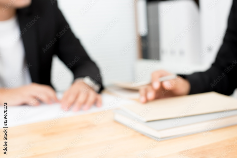 Blurred hands of businessmen on conference table Blurred hands of businessmen on conference table