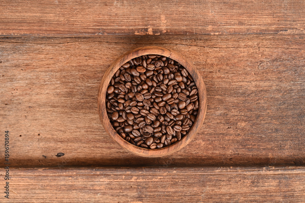 Freshly coffee beans in bowl for background Freshly coffee beans in bowl for background