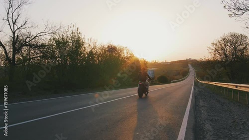motorbike on the road riding. having fun driving the empty road on a motorcycle tour journey. copyspace for your individual text.