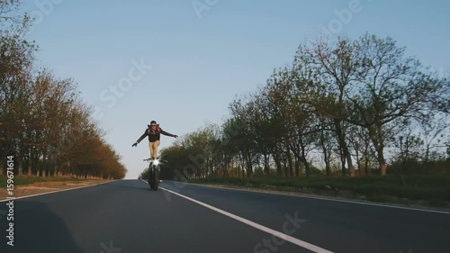 motorbike on the road riding. having fun driving the empty road on a motorcycle tour journey. copyspace for your individual text.