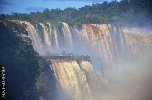 The Iguazu Falls  Iguaz   Falls  Iguassu Falls  or Igua  u Falls  on the Iguazu River on the border of the Argentine province of Misiones and the Brazilian state of Paran  . 