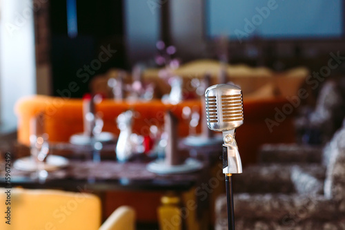 Canvas Print Retro karaoke microphone on restaurant background.