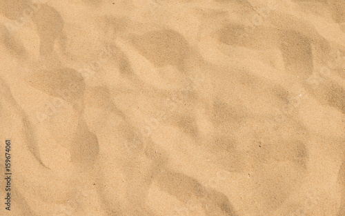 closeup of sand pattern of a beach in the summer