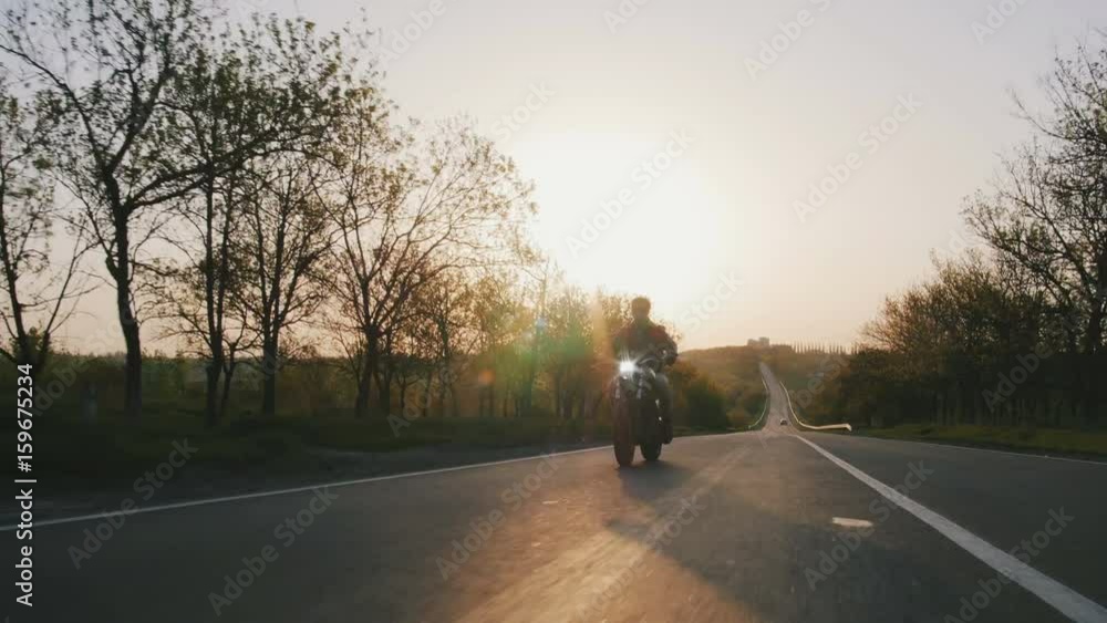 motorbike on the road riding. having fun driving the empty road on a motorcycle tour journey. copyspace for your individual text. motorbike on the road riding. having fun driving the empty road on a motorcycle tour journey. copyspace for your individual text.