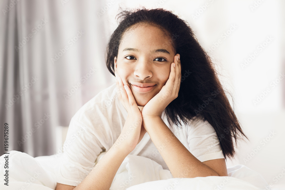 american cute girl smile in bedroom on white bed american cute girl smile in bedroom on white bed