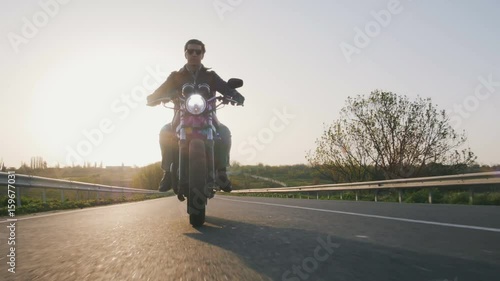 motorbike on the road riding. having fun driving the empty road on a motorcycle tour journey. copyspace for your individual text.