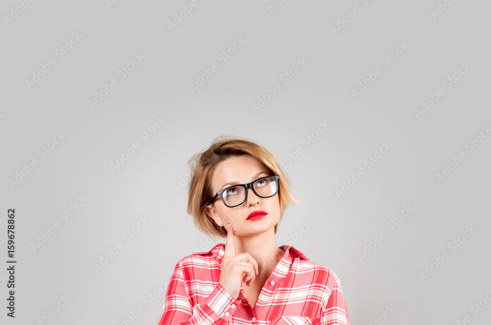 Portrait of business lady looking up. Beautiful thinking woman has ideas or dreams Portrait of business lady looking up. Beautiful thinking woman has ideas or dreams