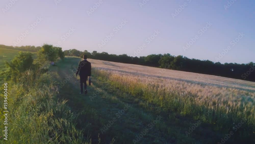 Stay on your way. Young businessman in the middle of the nature Stay on your way. Young businessman in the middle of the nature