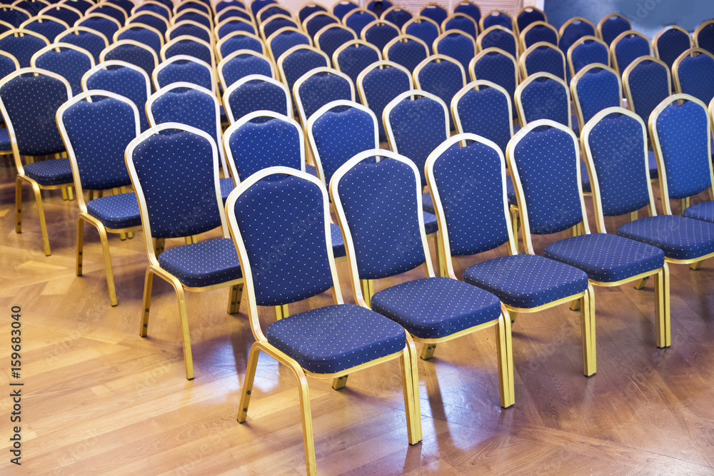 Fototapeta premium Empty conference chairs in row at a business room