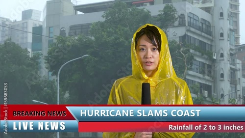 Asian female TV weather reporter reporting on hurricane
