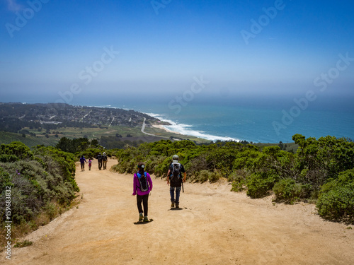 Family hiking in Montara, California with beach and ocean