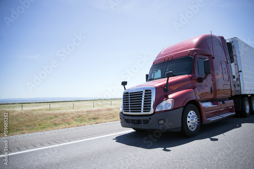 Wallpaper Mural Modern red semi truck and reefer trailer on road in sunny day Torontodigital.ca