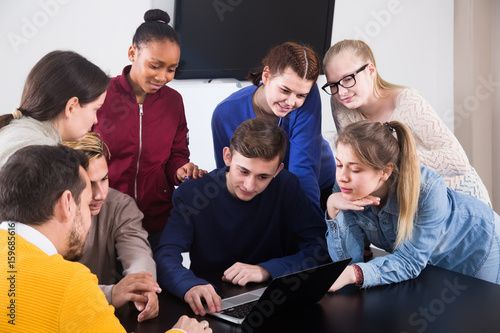 classmates having difficult project to complete during class