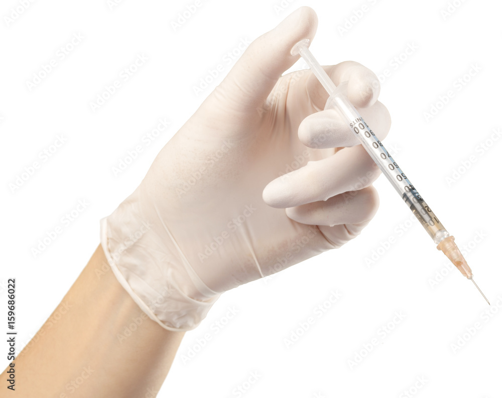 Syringe in hand isolated on white Syringe in hand isolated on white