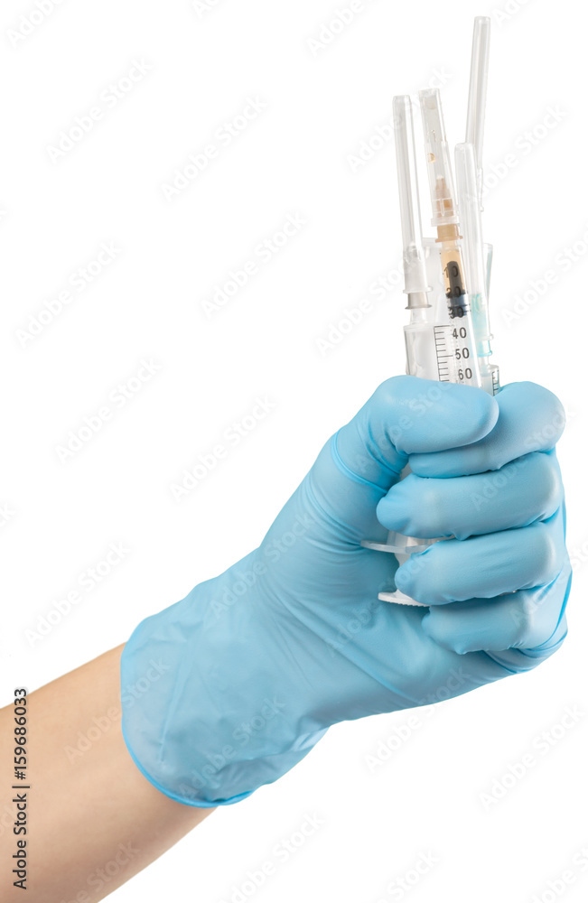 Syringe in hand isolated on white Syringe in hand isolated on white