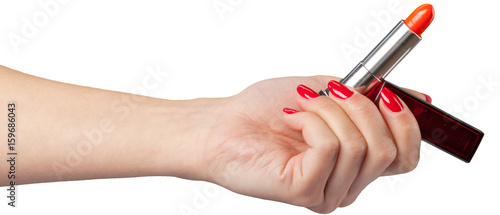 lipstick in hand isolated on white .