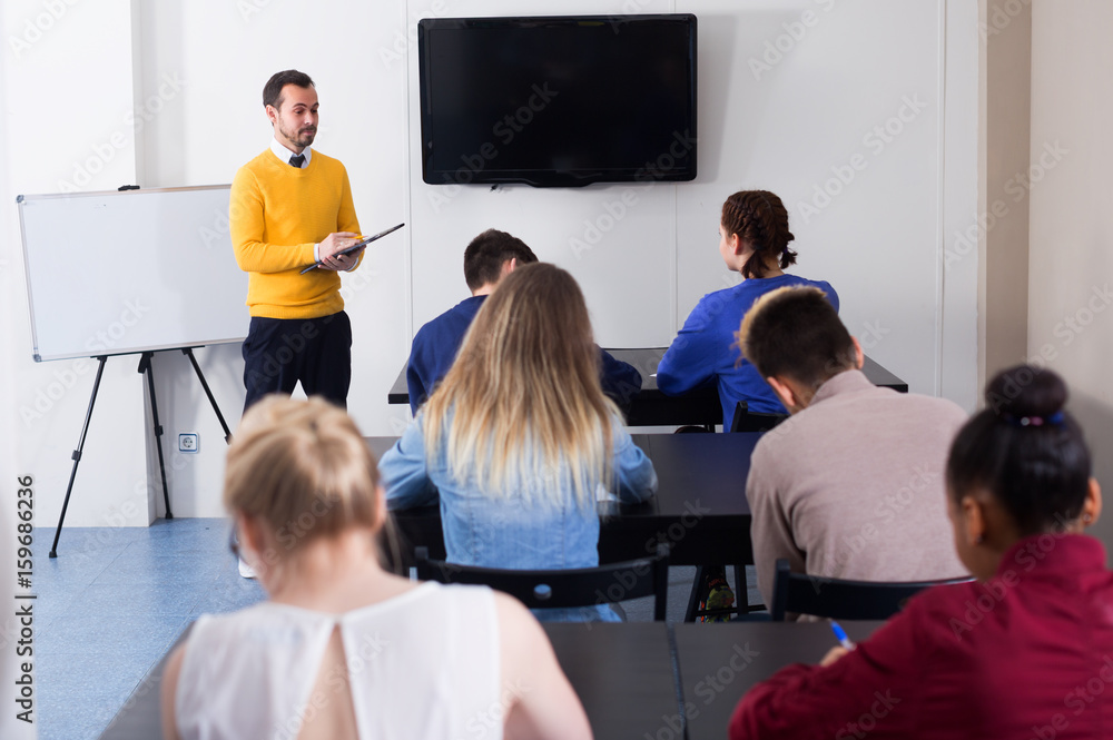 Teacher is monitoring students