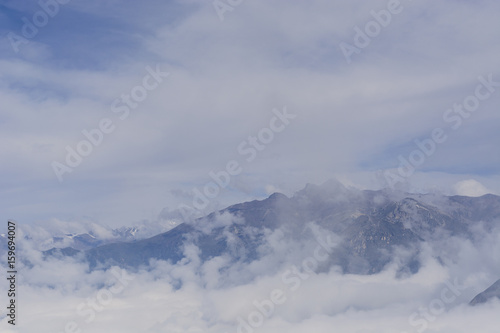 Andes peaks emerging from a sea of clouds, view from Colca Valley, Peru. © skinfaxi