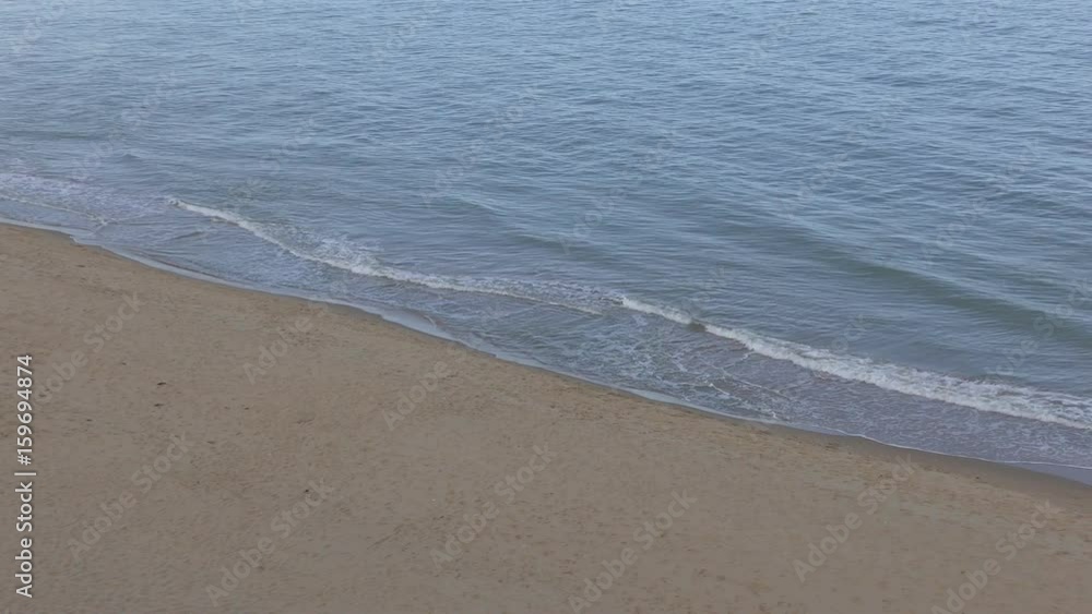 Sandy beach and waves of the sea. Sandy beach and waves of the sea.