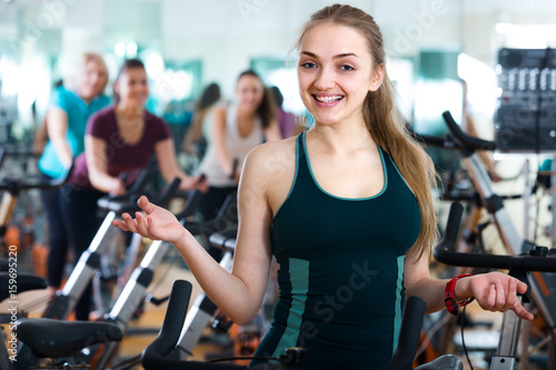 blonde woman posing in modern gym