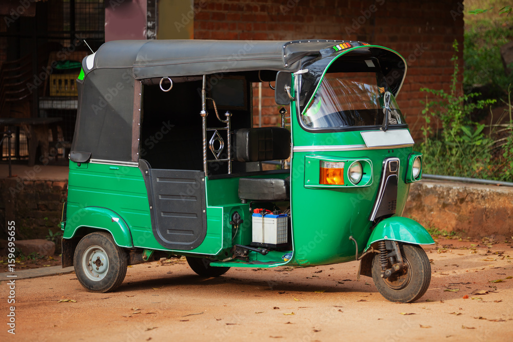 Small car with three wheels. Asian taxi tuk-tuk