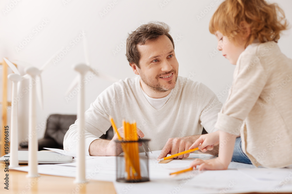 Positive delighted bearded man having conversation with his Positive delighted bearded man having conversation with his