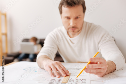 Attentive bearded man looking at the graph