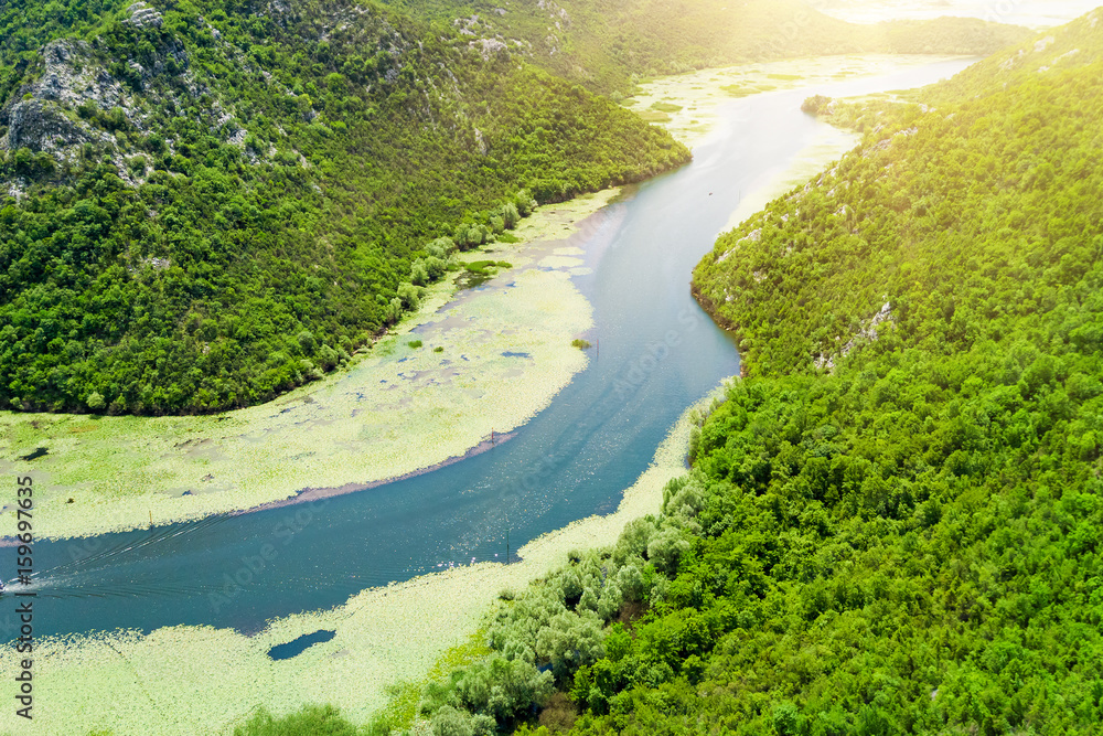 Top view of a river covered with green algae in the mountains Top view of a river covered with green algae in the mountains