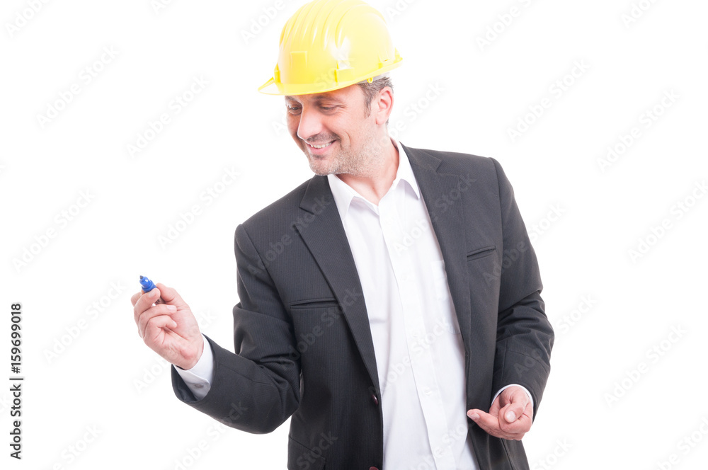 Portrait of architect wearing hardhat writing with marker Portrait of architect wearing hardhat writing with marker