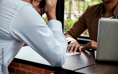 Fotografi Young frustrated businessman receiving dismiss notification from his partner for