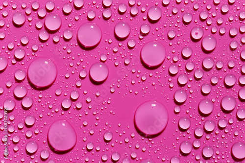 Fuchsia abstract background  rain drops on surface