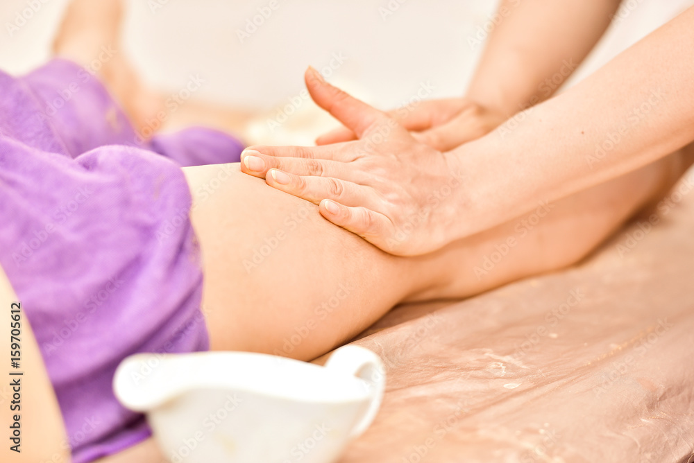 Naklejka premium Beautiful woman in spa salon,Leisure,The girl relaxes in the spa salon,portrait of young beautiful woman in spa environment