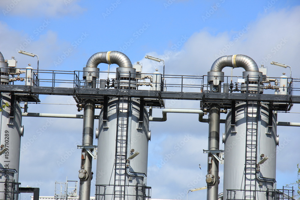Large metal silos in an industrial factory Large metal silos in an industrial factory