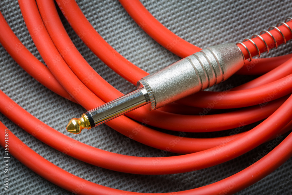 Red guitar cable jack
