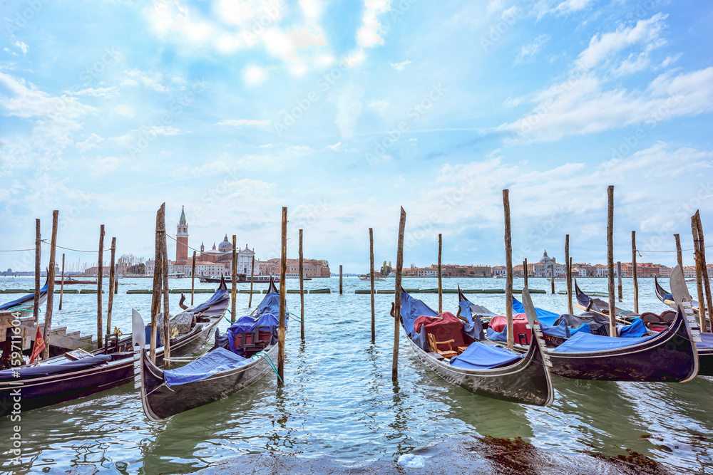 Grand canal in Venice, Piazza San Marco. On the background the island San Giorgio. Scenic cityscape with gondolas