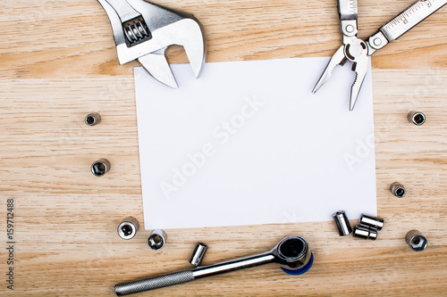 House making tools and empty sheet of paper. Studio shot on wooden background. Fathers day composition