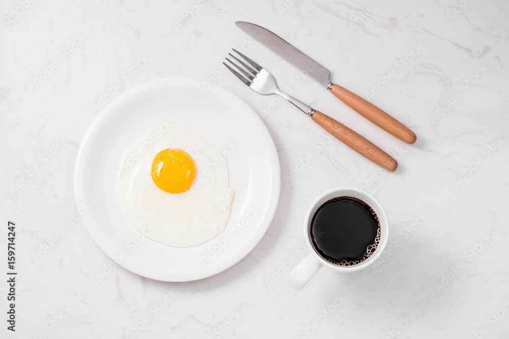 Top view of traditional healthy easy quick breakfast meal made of fried eggs served on a plate. Top view of traditional healthy easy quick breakfast meal made of fried eggs served on a plate.