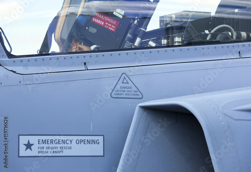 Obraz na plátne Cockpit of a tactical jet fighter with seat and instructions how to eject from the plane