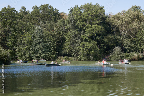 Central Park pond in New York with boats in a summer day