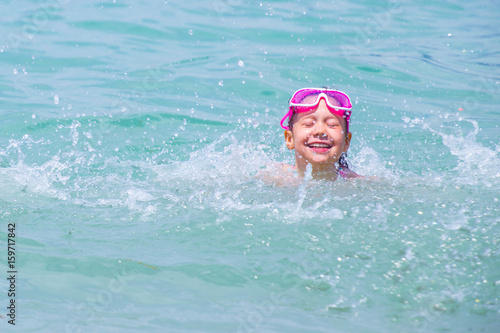 little girl swimming in sea © yanlev