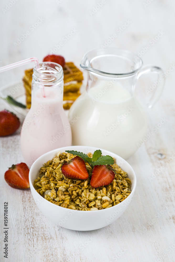 Granola with strawberry, milk and smoothies Granola with strawberry, milk and smoothies