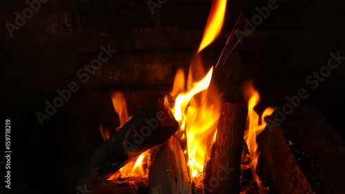 Braai barbecue wood fire coals with flames in pit - orange and red - South Africa