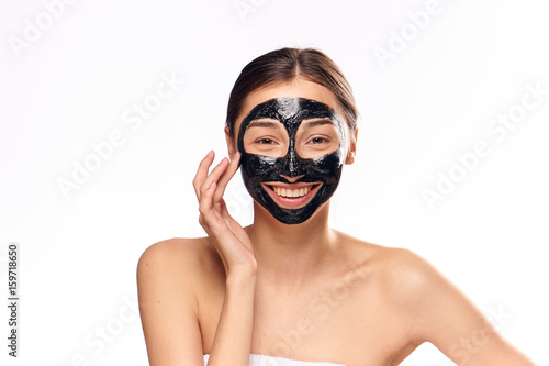 Woman smiling, woman in cosmetic mask for face on isolated background