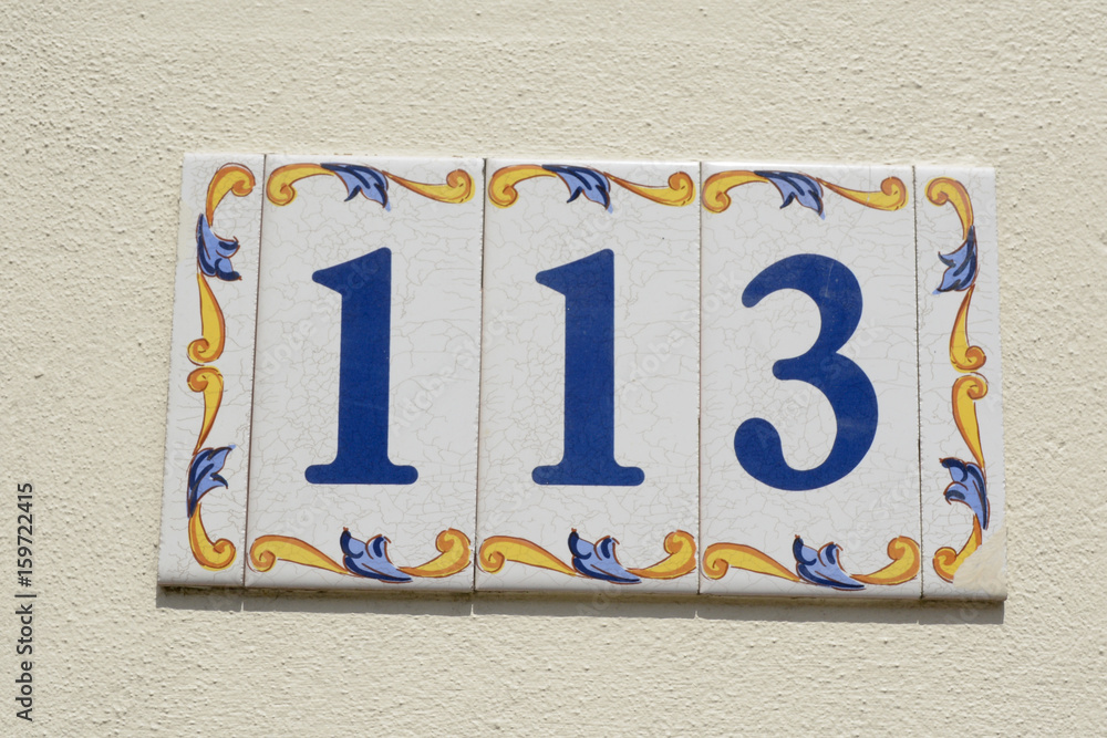 Fototapeta premium House number 113 sign in ceramic tiles
