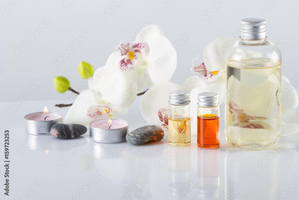 Spa concept. Aroma oil, candles, stones,orchid flowers Spa concept. Aroma oil, candles, stones,orchid flowers