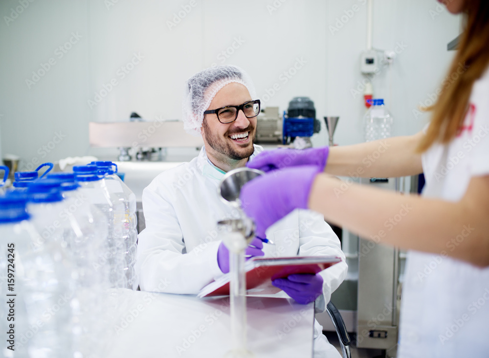 Lab technician doing chemical analysis. Testing chemical composition of the water. Lab technician doing chemical analysis. Testing chemical composition of the water.