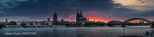 Panorama of the old evening Cologne. Rhine, railway bridge, cathedral