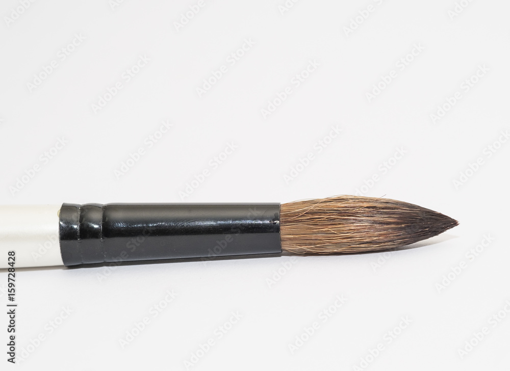 close up of a round artists paint brush close up of a round artists paint brush