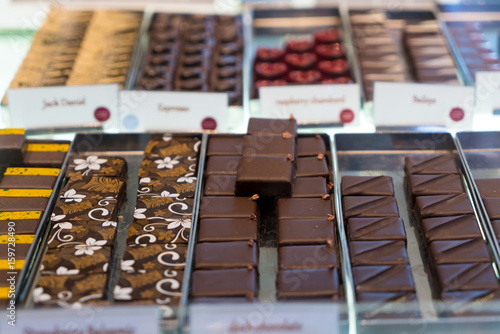 Photography chocolate truffles, candies and sweets store on showcase in factory store